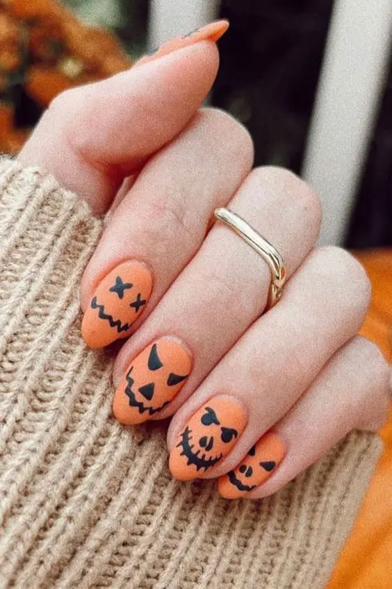 Pumpkin faces- Halloween Nail Designs